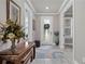 Bright and airy entryway with decorative furniture and tile flooring at 9777 Sw 63Rd Loop, Ocala, FL 34481