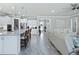 Modern kitchen with white cabinets and a large island at 9777 Sw 63Rd Loop, Ocala, FL 34481