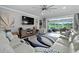 Light-filled living room with comfortable seating and a large TV at 9777 Sw 63Rd Loop, Ocala, FL 34481