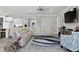 Spacious living room featuring a sectional sofa and large TV at 9777 Sw 63Rd Loop, Ocala, FL 34481