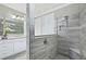 Spacious walk-in shower with tiled walls and built-in seat at 9777 Sw 63Rd Loop, Ocala, FL 34481