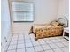 Bedroom with twin bed, tiled floors and wicker furniture at 110 Cypress Woods Ct # 7D, Deltona, FL 32725