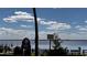 Peaceful lakefront view with walking path and boat ramp at 110 Cypress Woods Ct # 7D, Deltona, FL 32725