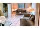 Bright living room featuring striped sofas and tiled floors at 110 Cypress Woods Ct # 7D, Deltona, FL 32725