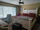 Primary bedroom offers a ceiling fan, a window, and a decorative headboard at 1461 N Felton St, Deltona, FL 32725