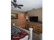 Bedroom featuring a built-in wooden dresser and a television for entertainment and relaxation at 1461 N Felton St, Deltona, FL 32725