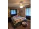Bedroom features patterned bedding and curtains with matching pillows at 1461 N Felton St, Deltona, FL 32725