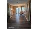 Inviting dining area with wood floors and a view of the backyard through sliding glass doors at 1461 N Felton St, Deltona, FL 32725