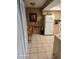 Kitchen boasts tile flooring, a wine rack, and white appliances at 1461 N Felton St, Deltona, FL 32725