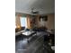 Comfortable living room with a ceiling fan, a plush sofa, and a wall-mounted television at 1461 N Felton St, Deltona, FL 32725