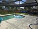 Backyard screened pool with an expansive deck, perfect for relaxing and entertaining guests at 1461 N Felton St, Deltona, FL 32725