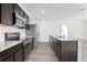 Well-equipped kitchen featuring granite countertops, stainless steel appliances, and dark cabinetry at 2126 7Th Ave, Deland, FL 32724