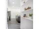 Kitchen with stainless steel appliances and kitchen island adjacent to built-in shelves at 2126 7Th Ave, Deland, FL 32724
