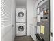 Laundry area featuring a stacked washer/dryer and utility sink at 2126 7Th Ave, Deland, FL 32724