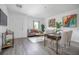 Bright living area with gray wood floors, comfortable seating, and stylish modern decor at 2126 7Th Ave, Deland, FL 32724