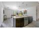 Open floor plan with kitchen island overlooking the living area, ideal for entertaining guests at 2126 7Th Ave, Deland, FL 32724