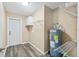 Laundry room with shelving and vinyl flooring at 456 S Leavitt Ave, Orange City, FL 32763