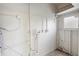Clean basement utility area with white walls, pipes, wiring and a small window at 522 Powers Ave, Port Orange, FL 32127