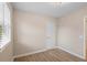 Cozy bedroom with natural light from a window, neutral walls, and wood-look flooring at 522 Powers Ave, Port Orange, FL 32127