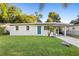 Picture of an inviting single-story home with a striking blue door, set on a well-kept lawn at 522 Powers Ave, Port Orange, FL 32127