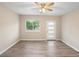 Inviting living room boasts natural light, neutral walls and contemporary flooring at 522 Powers Ave, Port Orange, FL 32127
