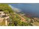 An aerial view showing the nearby ocean, with trees, shrubs, and shoreline visible in frame at 140 Orchid Woods Ct # 11A, Deltona, FL 32725