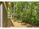 Lush backyard views of the tree line add an element of privacy to the home at 140 Orchid Woods Ct # 11A, Deltona, FL 32725