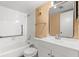 Neat bathroom with a tub-shower combo and white vanity at 140 Orchid Woods Ct # 11A, Deltona, FL 32725