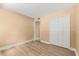 Comfortable bedroom with wood-look floors and a closet at 140 Orchid Woods Ct # 11A, Deltona, FL 32725
