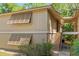 Inviting two-story condo with neutral siding, louvered windows and a private entrance via stairway at 140 Orchid Woods Ct # 11A, Deltona, FL 32725