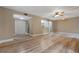 Open-concept living room with closet, kitchen pass-through at 140 Orchid Woods Ct # 11A, Deltona, FL 32725