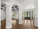 Spacious foyer with columns, coffered ceiling, and large windows for natural light at 4 Broad Creek Cir, Ormond Beach, FL 32174