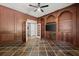 Elegant wood-paneled office with built-in shelving and a large window for natural light at 4 Broad Creek Cir, Ormond Beach, FL 32174
