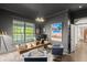 Home office featuring natural light, modern decor, hardwood floors and ample workspace at 4 Broad Creek Cir, Ormond Beach, FL 32174