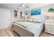 Spacious bedroom with king-size bed and coastal art at 2663 Carthage Dr, New Smyrna Beach, FL 32168