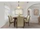 Formal dining room with six chairs and large artwork at 4345 Heath Land Ln, Lake Wales, FL 33859