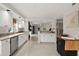 Open concept kitchen with white cabinetry and stainless steel appliances offering great views at 4650 Links Village Dr # C303, Ponce Inlet, FL 32127