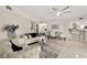 Spacious living room boasts an open floor plan, tile floors, contemporary furnishings, and modern decor at 4650 Links Village Dr # C303, Ponce Inlet, FL 32127