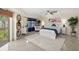Inviting main bedroom featuring ample natural light, a plush bed, and stylish decor at 4650 Links Village Dr # C303, Ponce Inlet, FL 32127