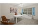 Office space featuring a large window, a white desk, and light-colored walls at 4650 Links Village Dr # C303, Ponce Inlet, FL 32127