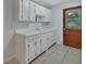 Functional kitchen featuring ample counter space and classic white cabinets at 532 W Wisconsin Ave, Deland, FL 32720