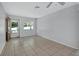Bright living room featuring tile flooring and a large window for natural light at 532 W Wisconsin Ave, Deland, FL 32720