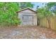 Exterior view of the shed in the fenced and treed backyard at 532 W Wisconsin Ave, Deland, FL 32720