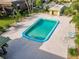 Aerial shot of the community pool, highlighting its size and proximity to residences and parking at 600 N Boundary Ave # 106D, Deland, FL 32720