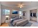 Bedroom featuring a large bed, cool tones, and a well-organized closet with lots of storage at 119 Bigelow Dr, Edgewater, FL 32132