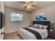 Comfortable bedroom with a large bed, television, neutral tones, and simple decor at 119 Bigelow Dr, Edgewater, FL 32132