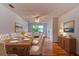 Well-lit dining room featuring a hardwood floor, a large table with seating, and lots of natural light at 119 Bigelow Dr, Edgewater, FL 32132