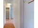 Hallway with tile flooring and a view of shelving and other rooms at 119 Bigelow Dr, Edgewater, FL 32132
