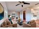Cozy living room with tile floors, ceiling fan, a large window and comfortable furniture at 119 Bigelow Dr, Edgewater, FL 32132