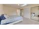 Bright bedroom with mirrored closet doors and a starfish patterned bedding at 4766 S Atlantic Ave, Ponce Inlet, FL 32127